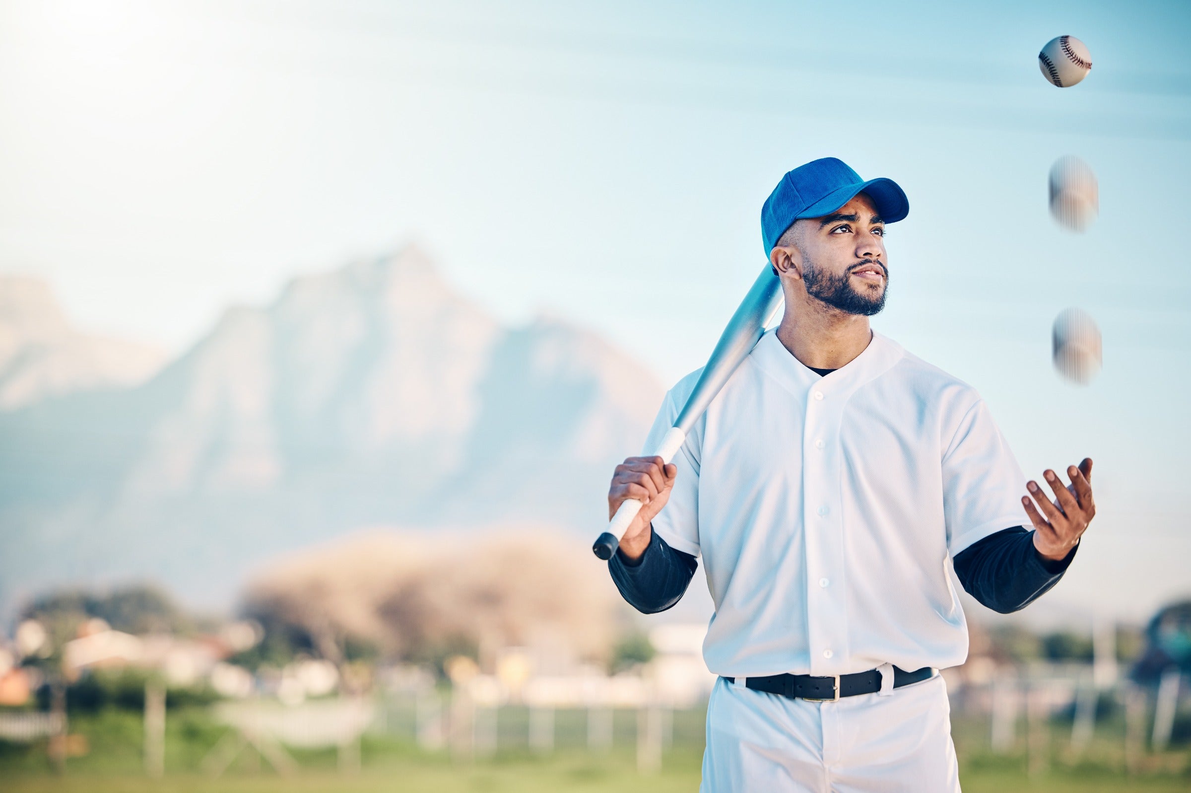 baseball player with fungo bat