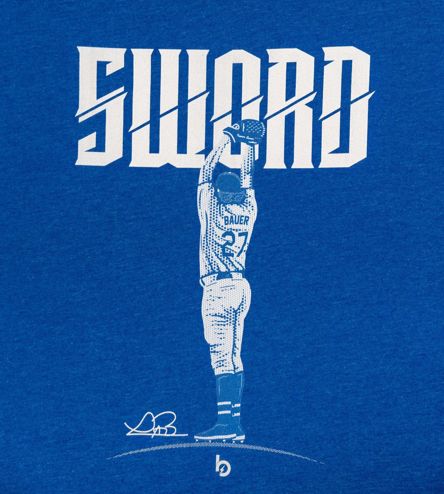 Bauer Outage Sword Tee featuring bold "SWORD" text and graphic of a player in a blue shirt, symbolizing strength and ambition.