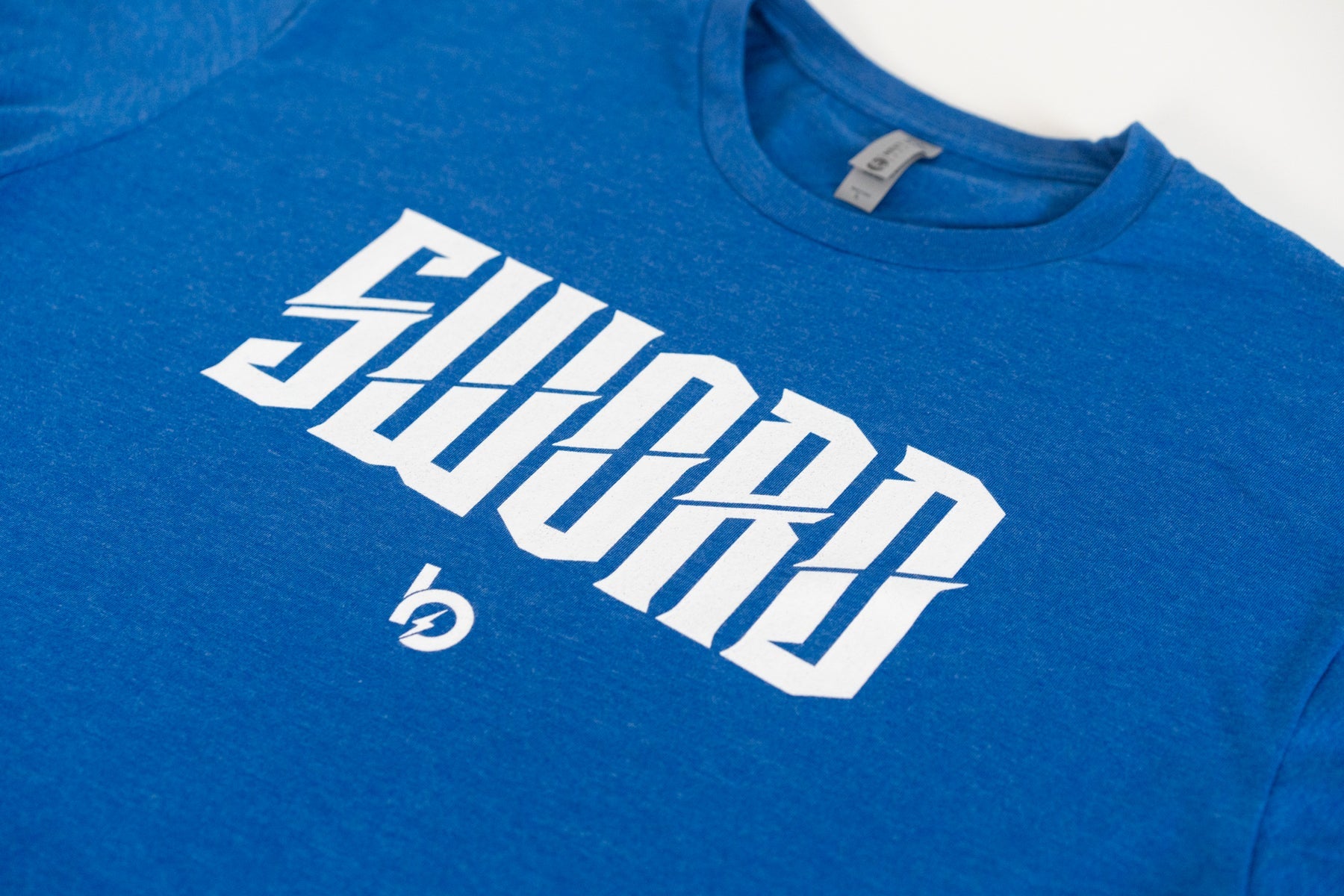 Bauer Outage Sword Logo Tee in blue featuring bold white 'SWORD' logo design on ultra soft fabric