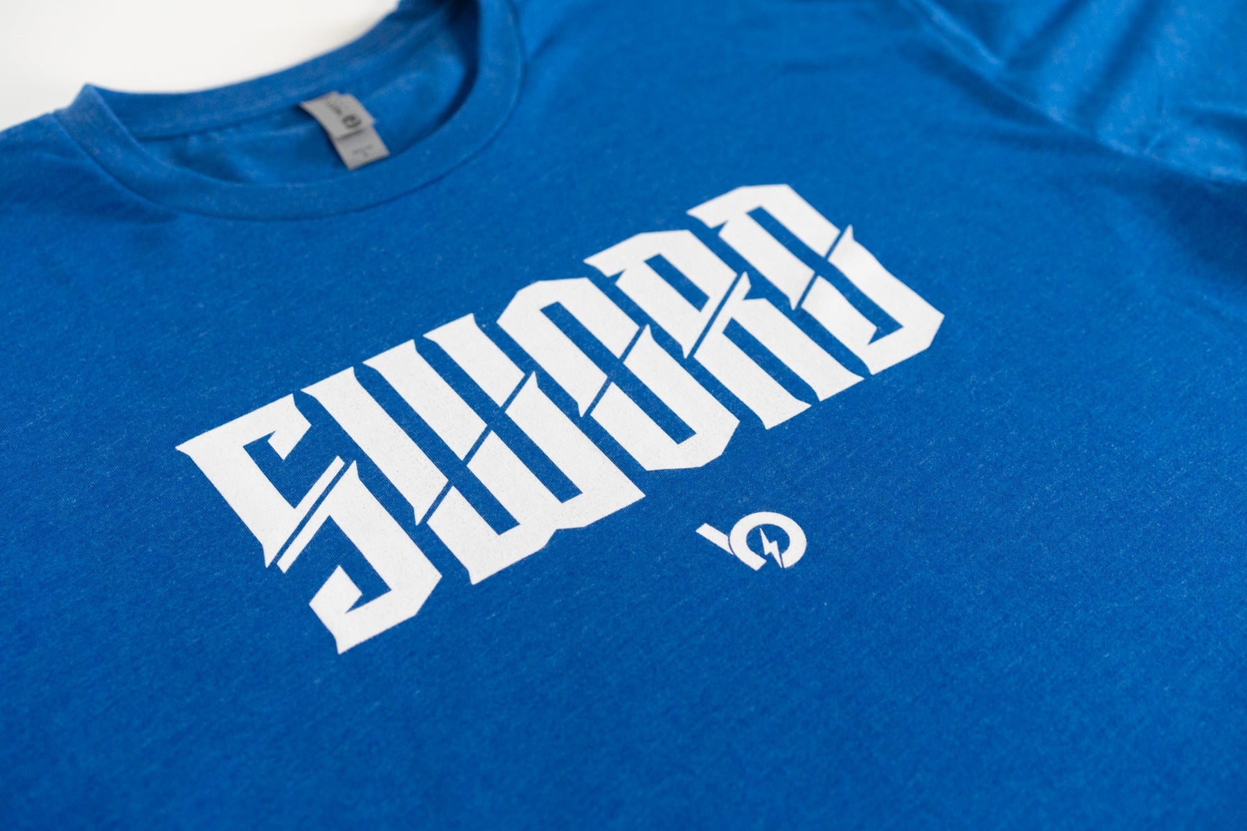 Bauer Sword Logo Tee in blue featuring bold white 'SWORD' text, symbolizing strength and excellence.