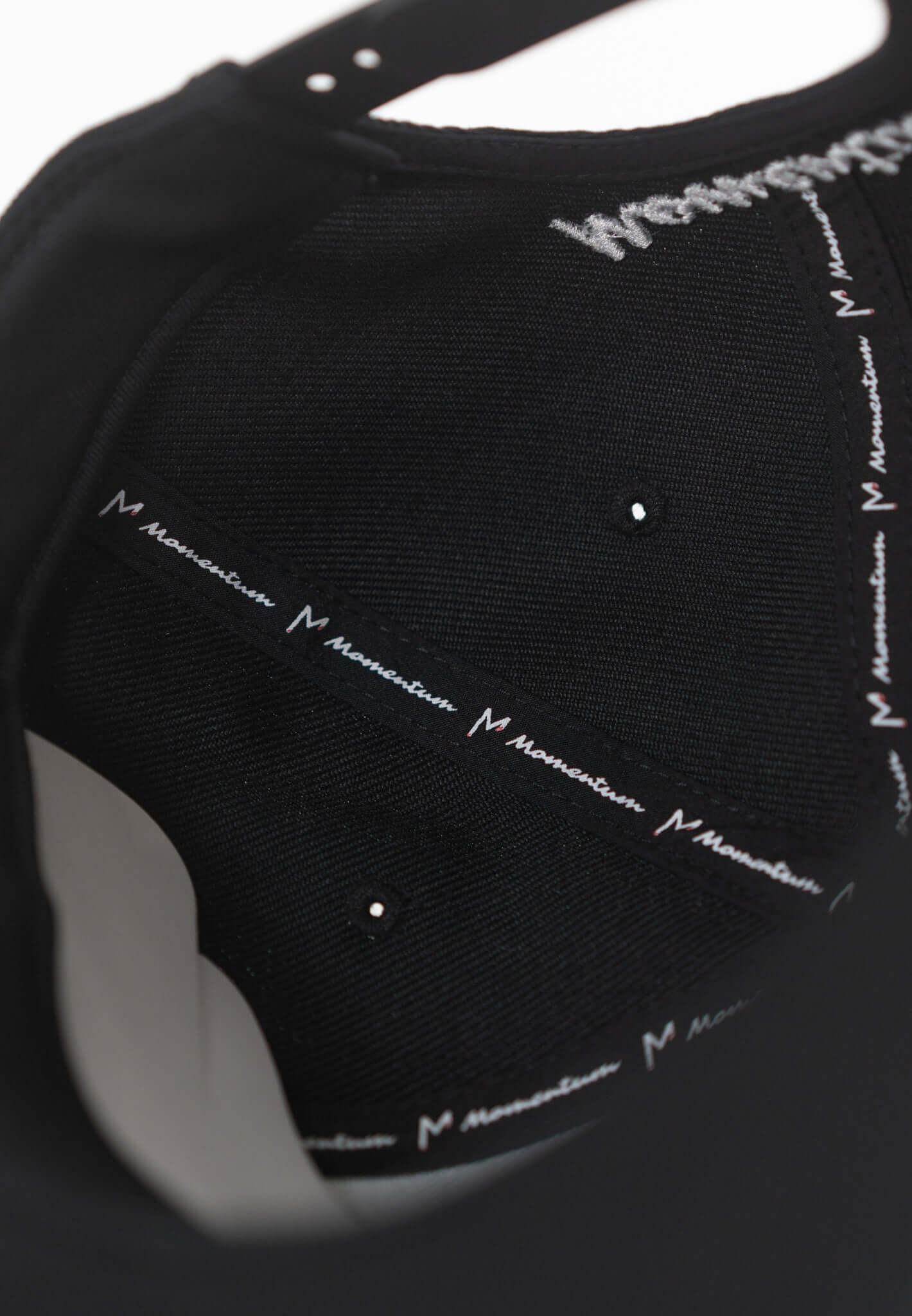 Inside view of the Momentum Snapback Hat showcasing branded lining and durable material for a comfortable fit.