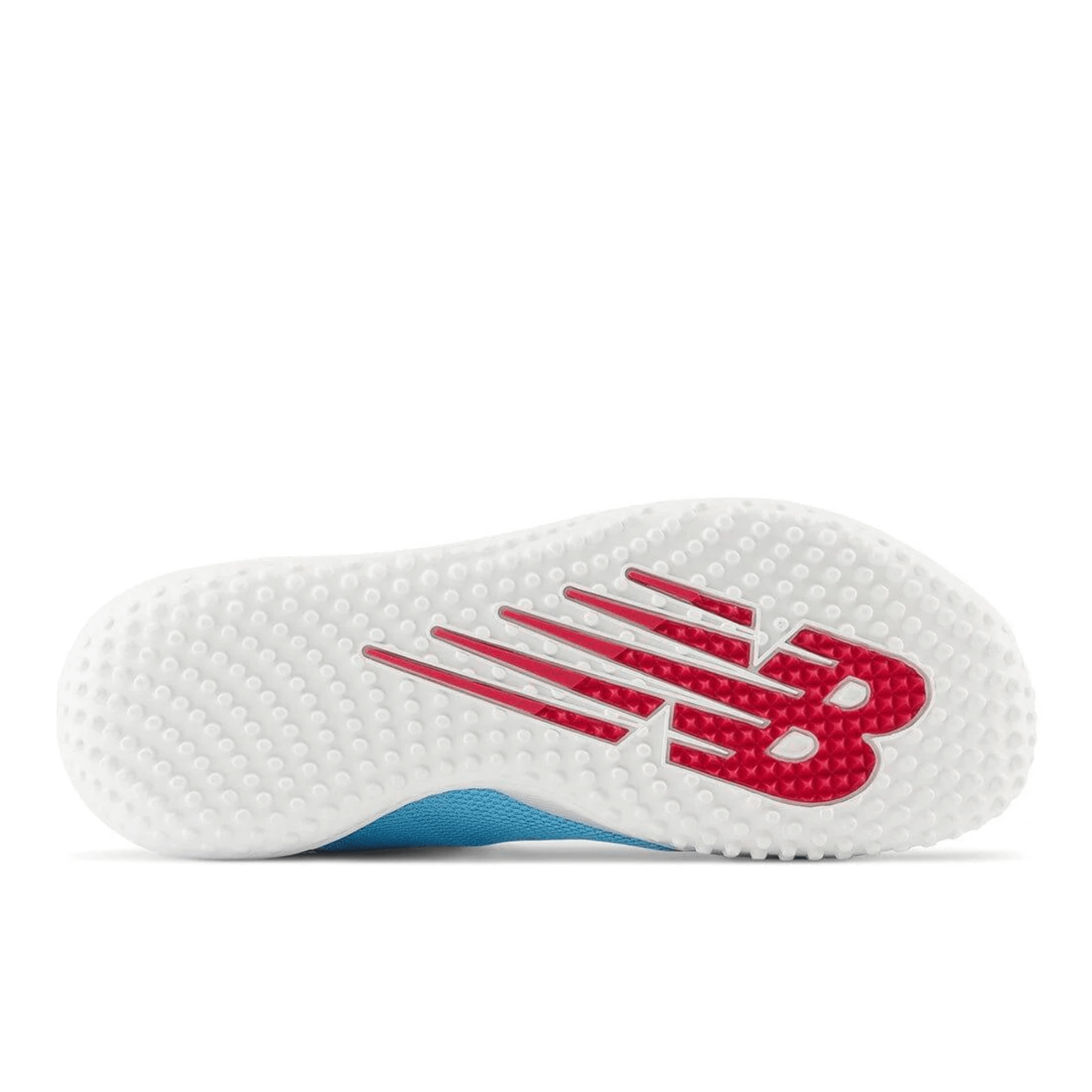 New Balance FuelCell 4040 v7 Turf Trainer outsole featuring a sky blue upper and red logo details.