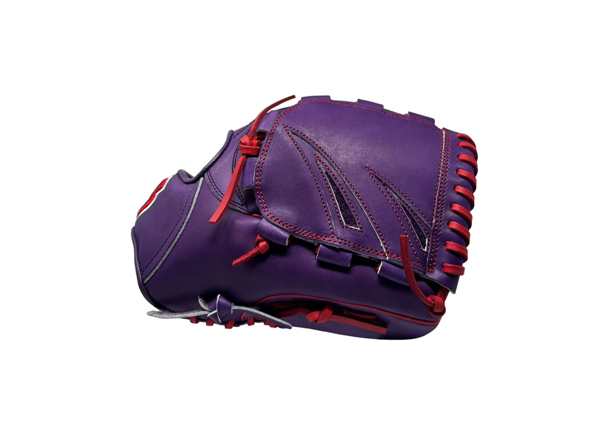  Detail of cushioned thumb slot in purple glove for enhanced comfort and fit.