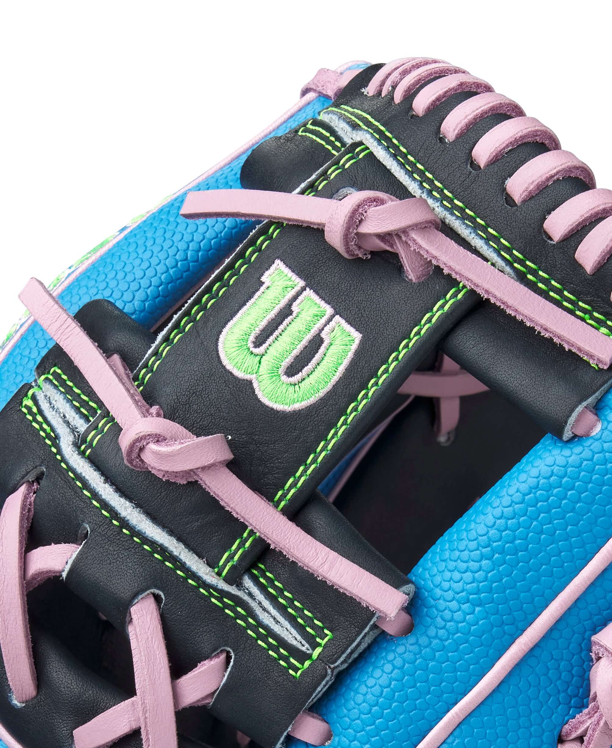 Close-up of Wilson A2000 1786SS glove showing Sky Blue SuperSkin™, Lavender accents, and green stitching details.