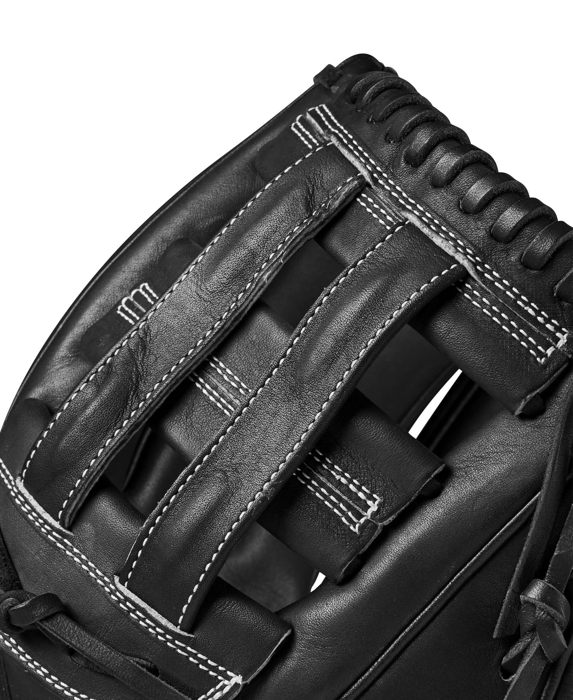 Close-up of Wilson A2000 PP05 glove's Dual Post Web, showcasing black leather and stitching details for durability.