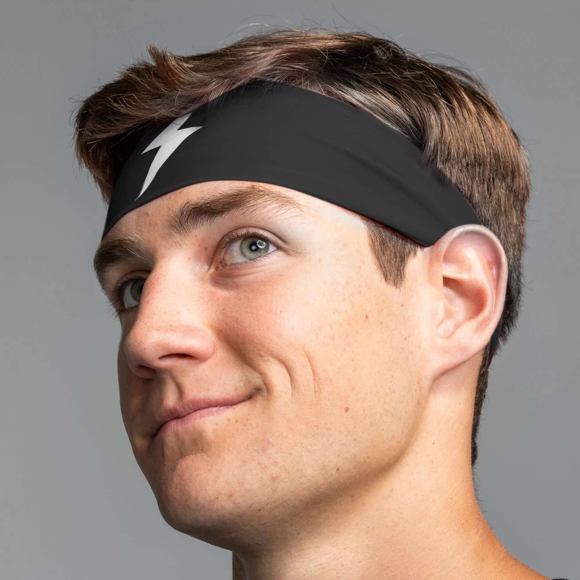 Bruce Bolt Performance Headband on a man, showcasing its black design and moisture-wicking features for workouts.