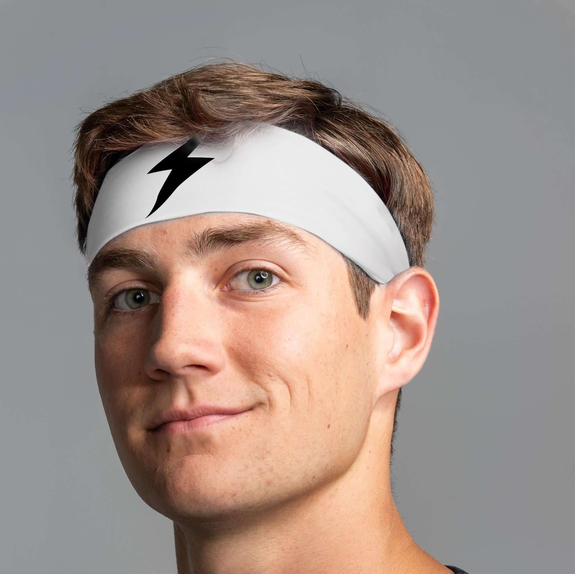 Bruce Bolt Performance Headband in white on a model, designed for sweat management during workouts and sports.