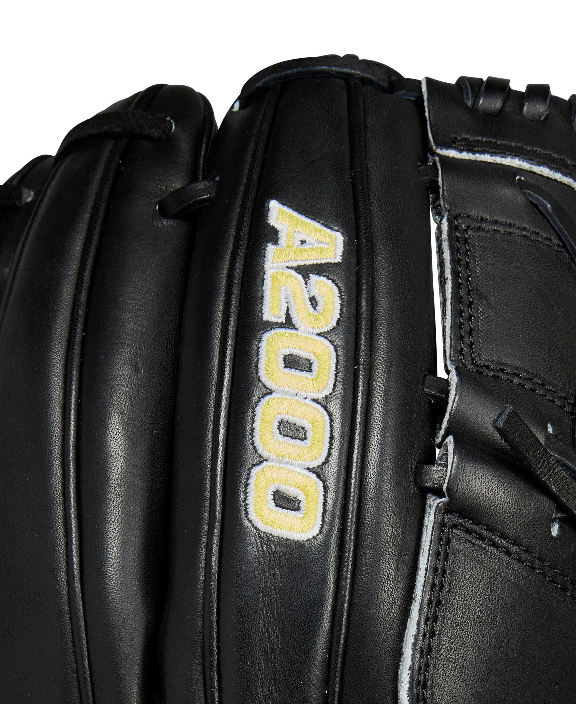 Close-up of the Wilson A2000 B2 baseball glove showing the logo and black Pro Stock leather texture.