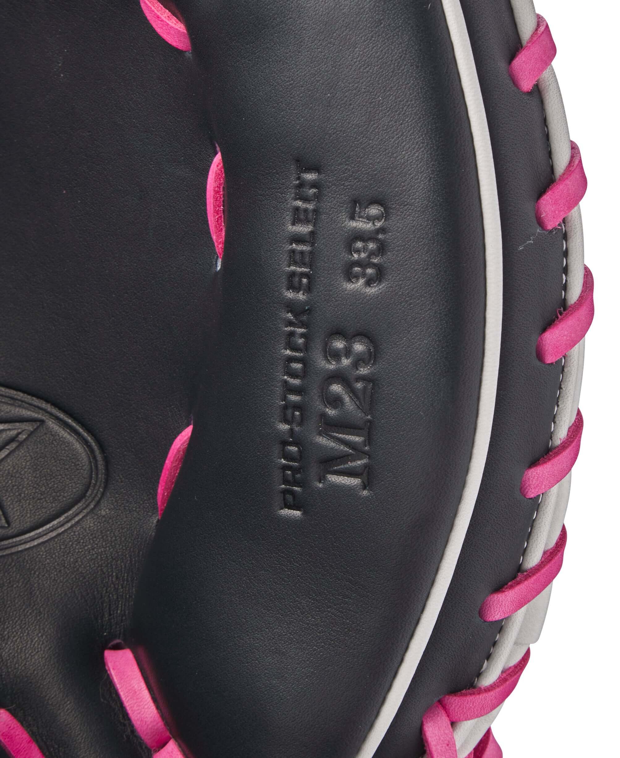 Interior view of Wilson A2K M23 catcher's mitt showing Pro Stock Select leather and pink lacing details.