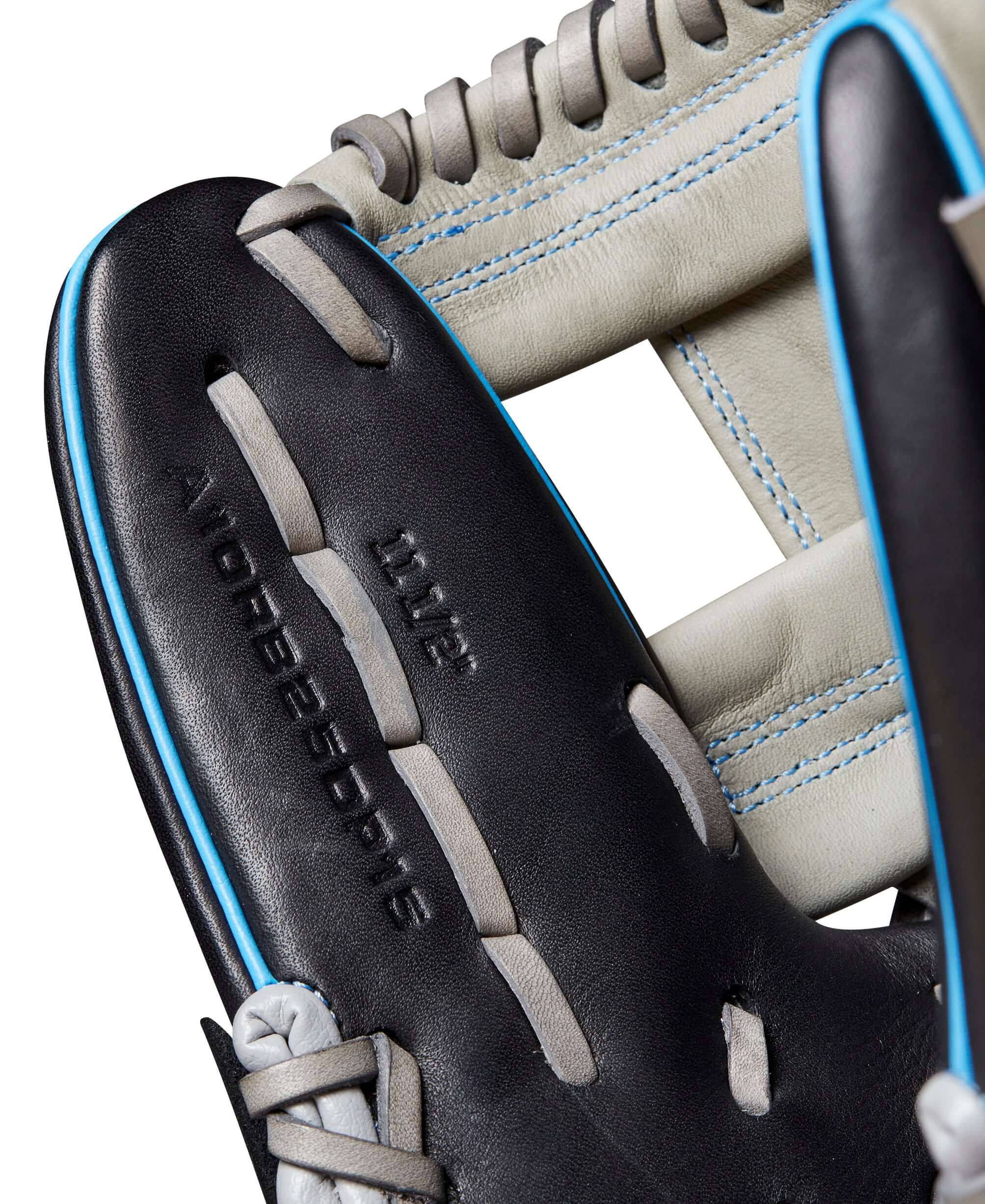 Close-up of Wilson 2024 A1000 DP15 baseball glove showing black, grey, and cool blue stitching with H-Web design.