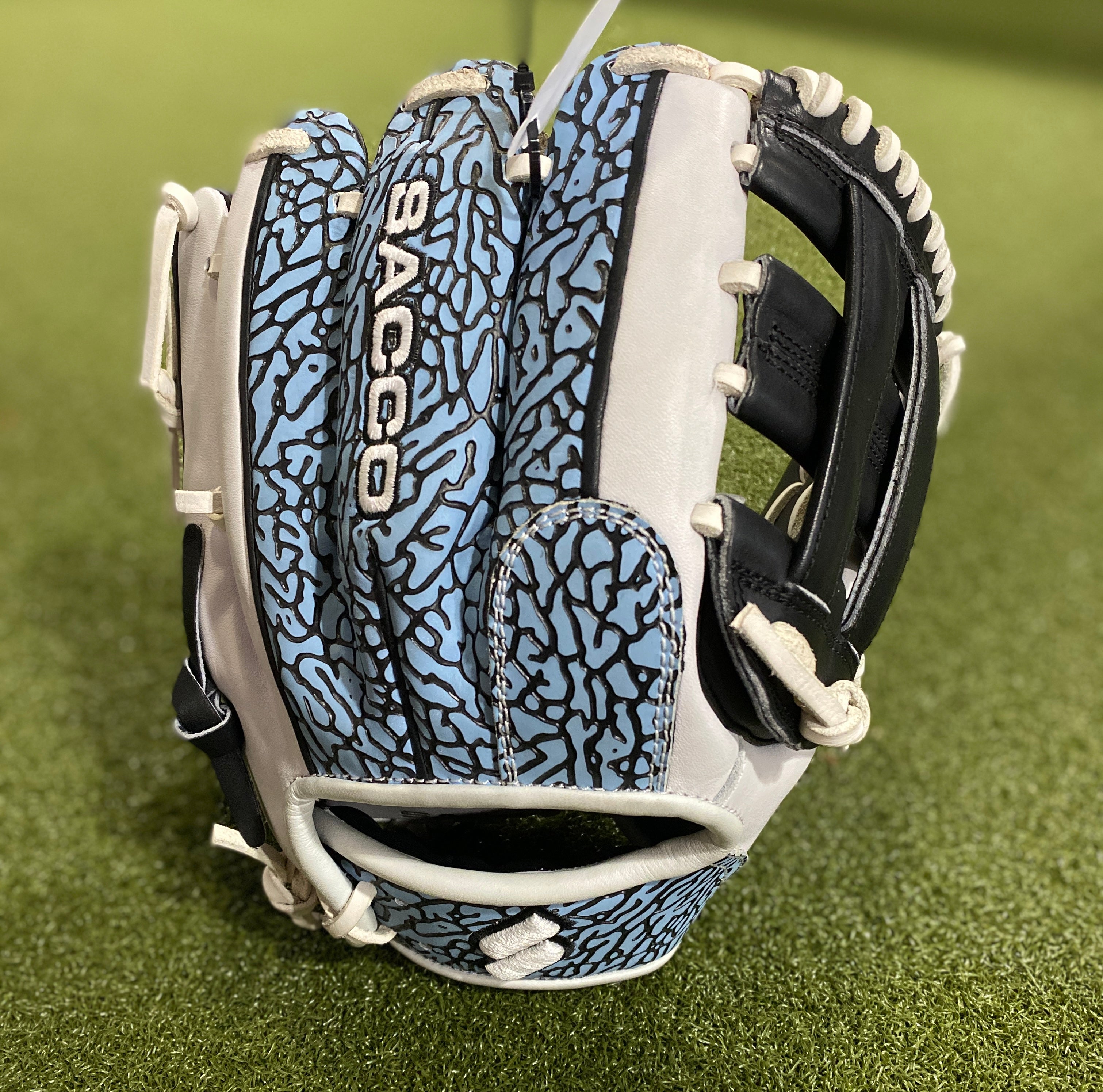 Sacco Ultra Premium RHT H-Web 11.5" baseball glove in white, black, and blue with intricate design, showcasing superior control and durability.