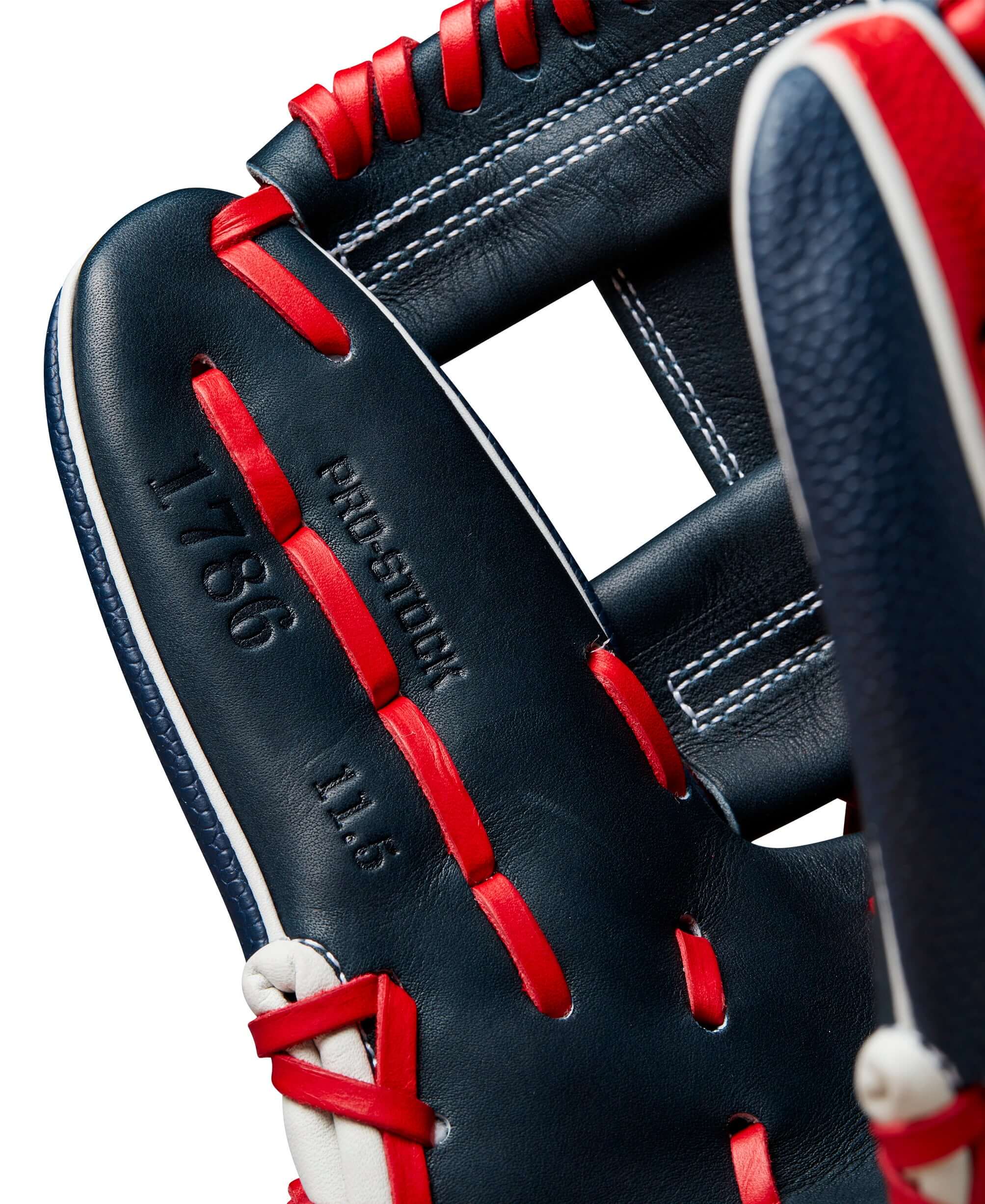 Close-up of Wilson A2000 1786 glove showcasing Navy Pro Stock leather and red lacing design, emphasizing 11.5" size.