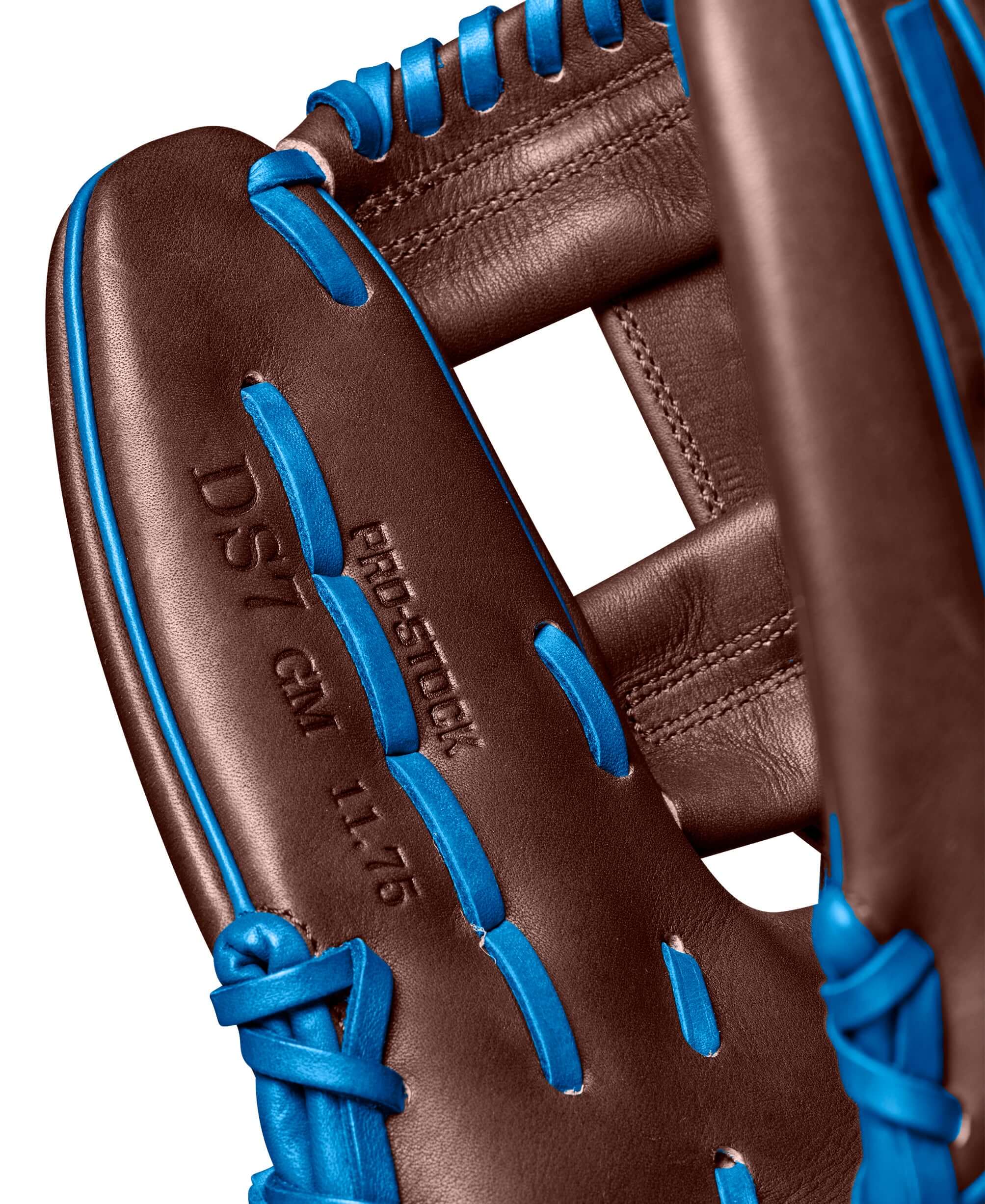 Close-up of the Wilson A2000 Dansby Swanson GM glove, showcasing blue lacing and detailed craftsmanship, 11.75 inches.