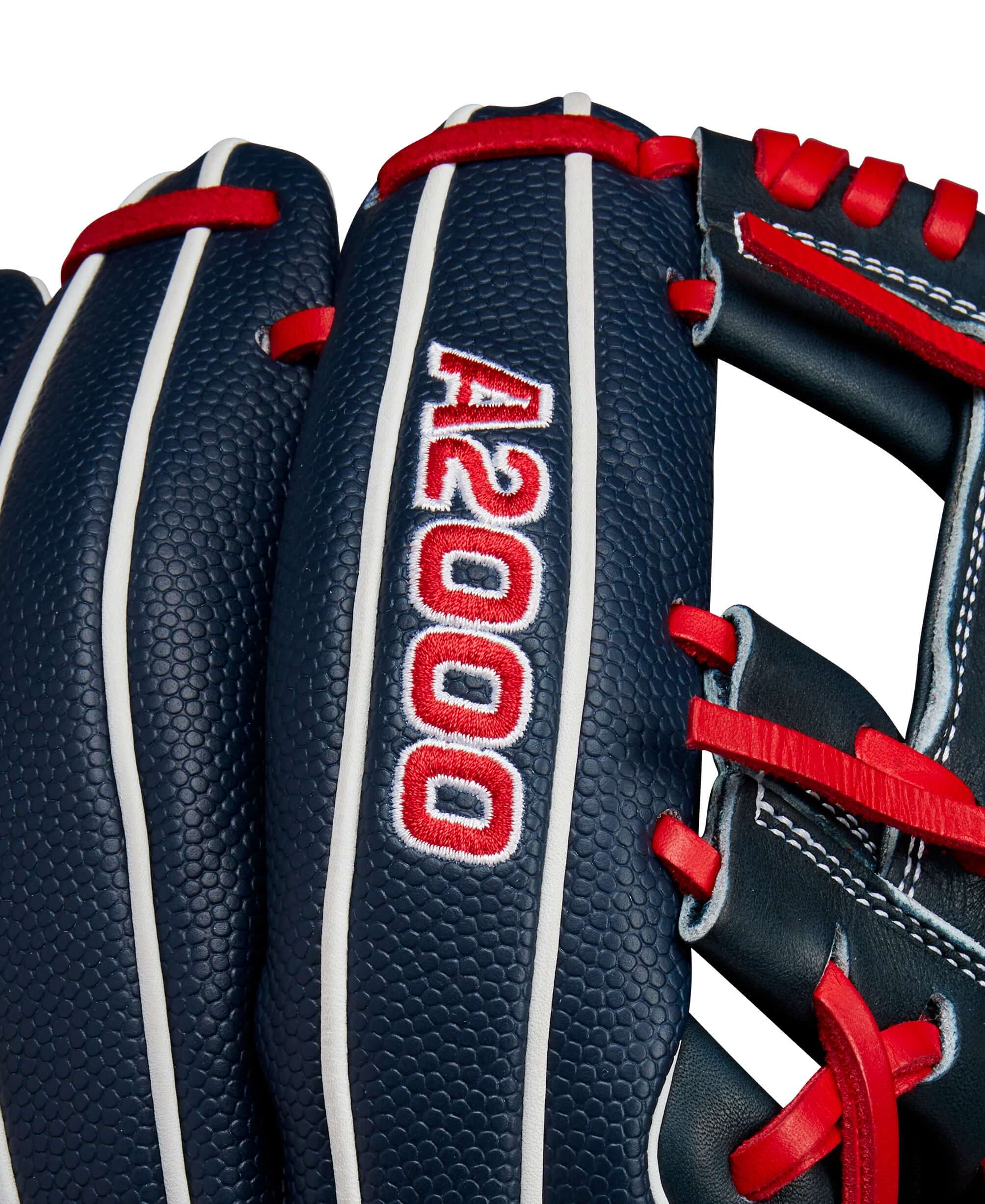 Close-up of Wilson A2000 glove featuring navy leather with red accents and bold logo for enhanced performance.