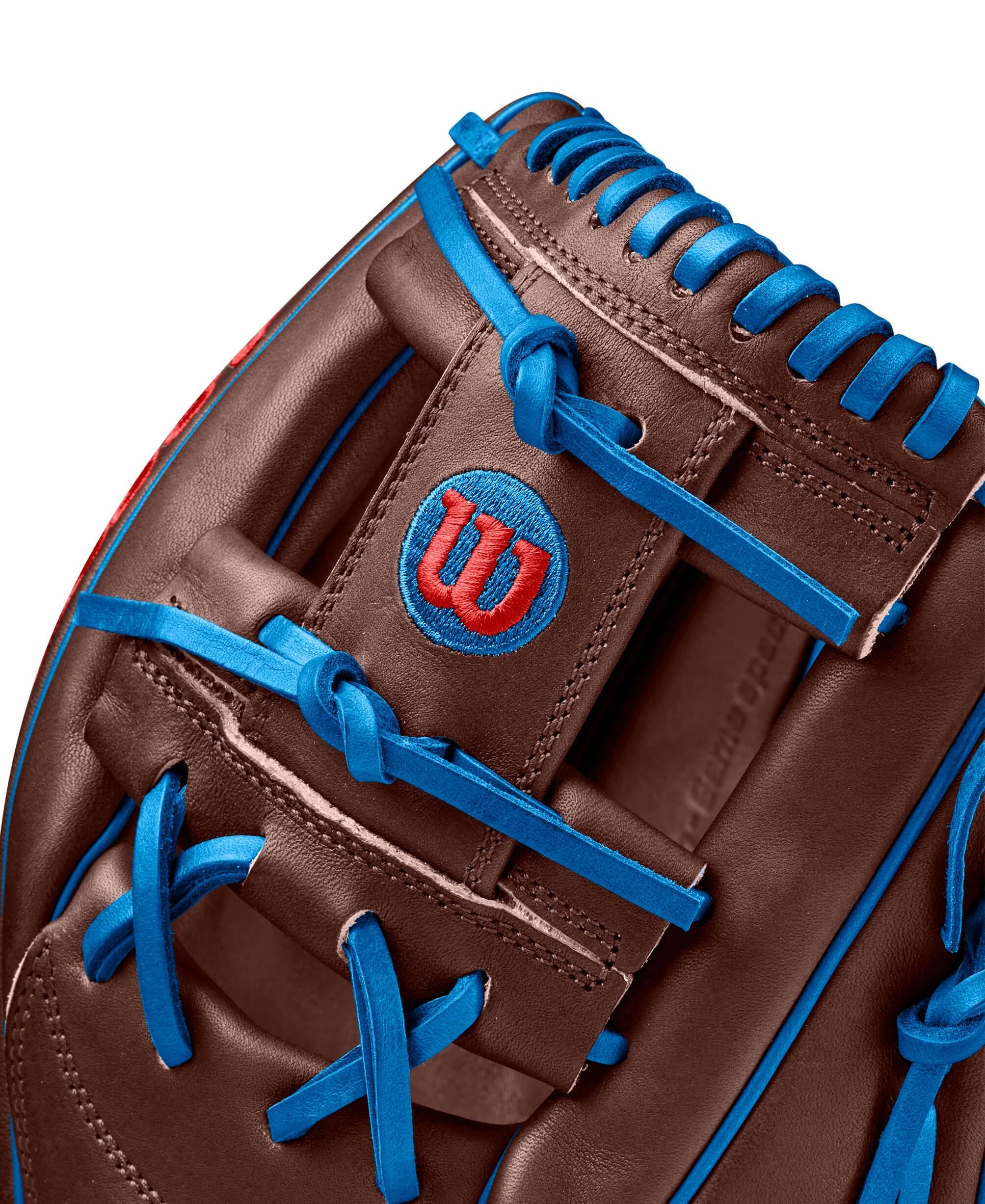 Wilson Spring 2025 A2000 Dansby Swanson GM 11.75" glove featuring brown leather with blue lacing and logo.