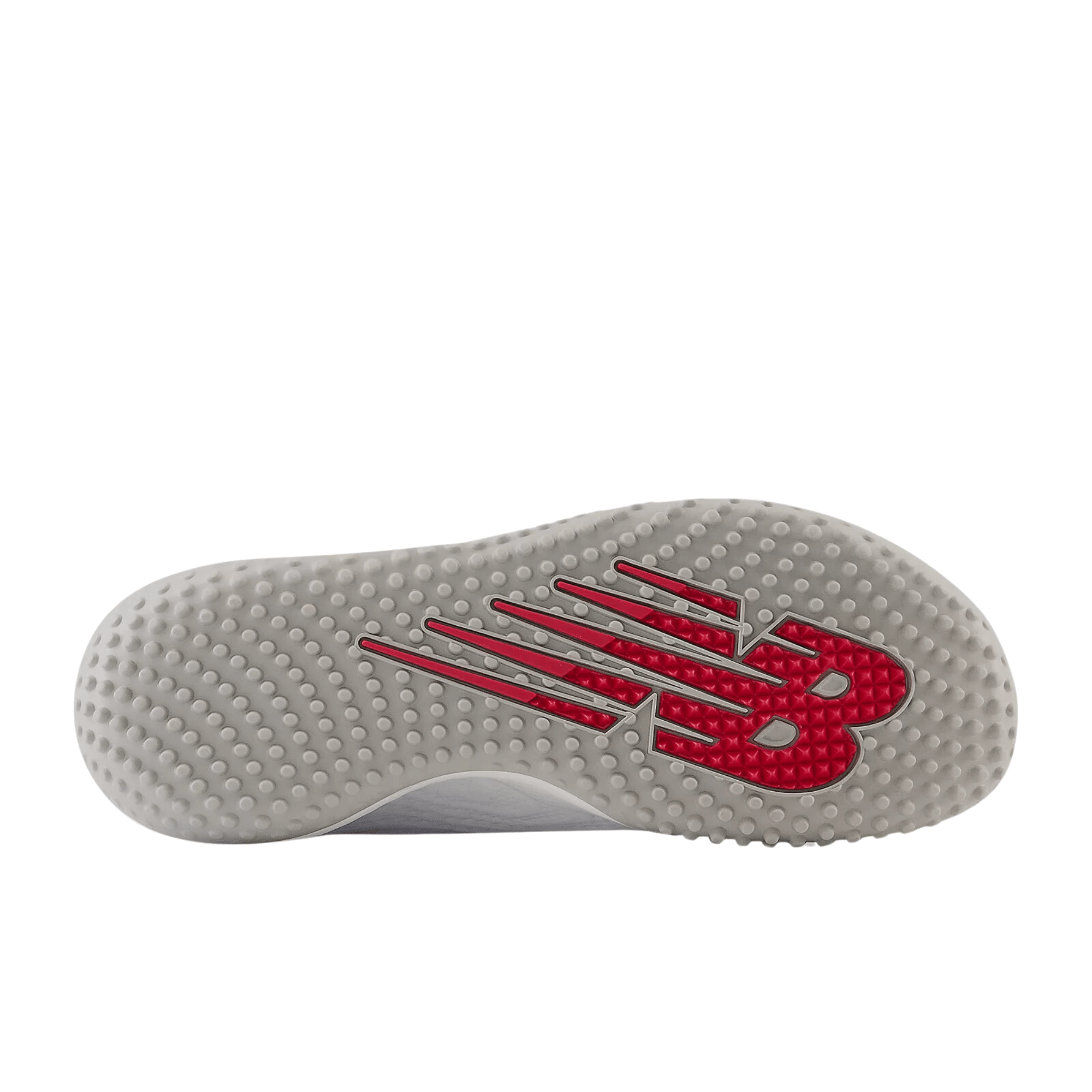 New Balance FuelCell 4040 v7 Turf Trainer outsole featuring aggressive rubber design and red branding.