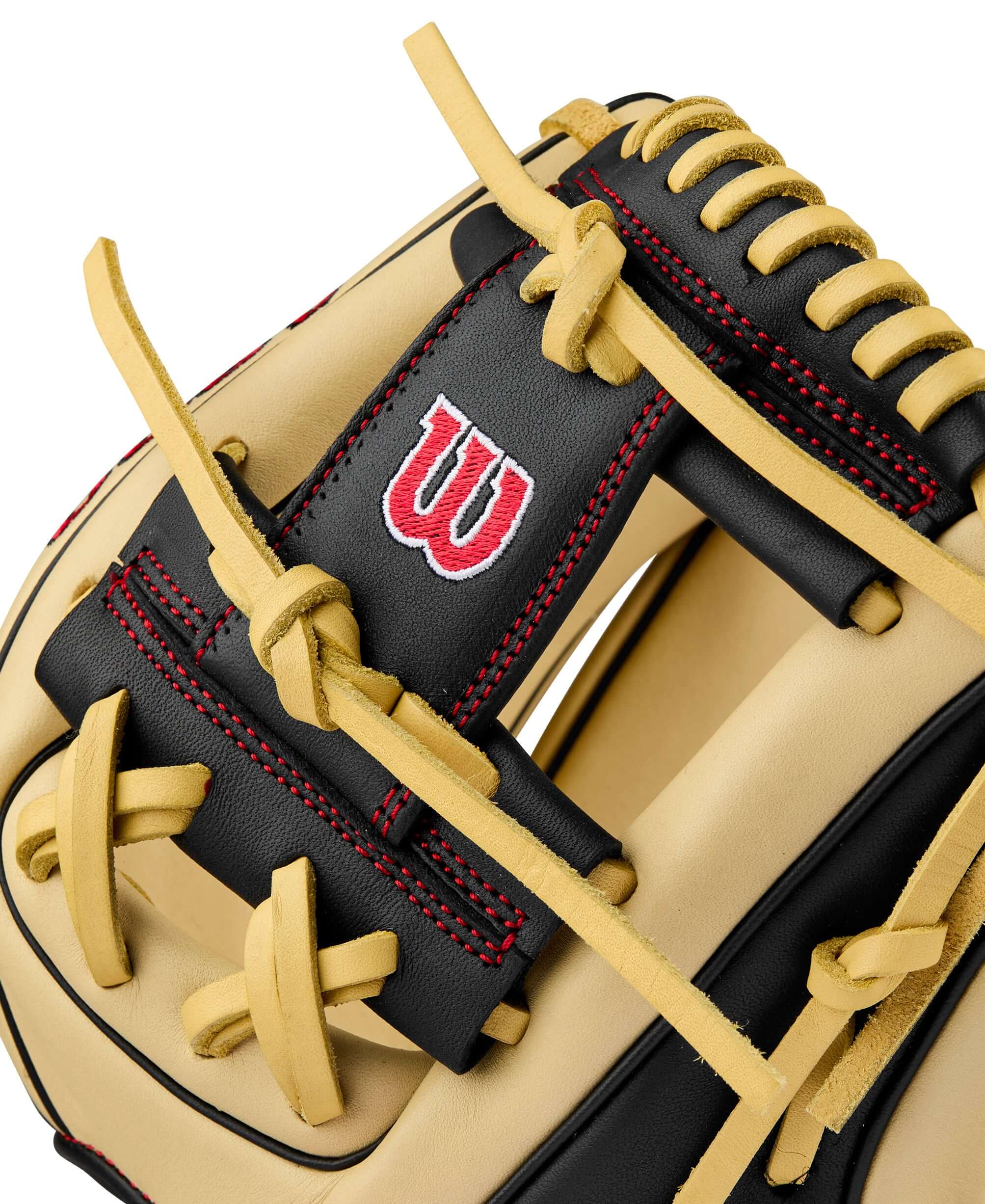 Wilson A900 PF115 youth baseball glove in blonde and black with red stitching and logo detail. Perfect for emerging players.