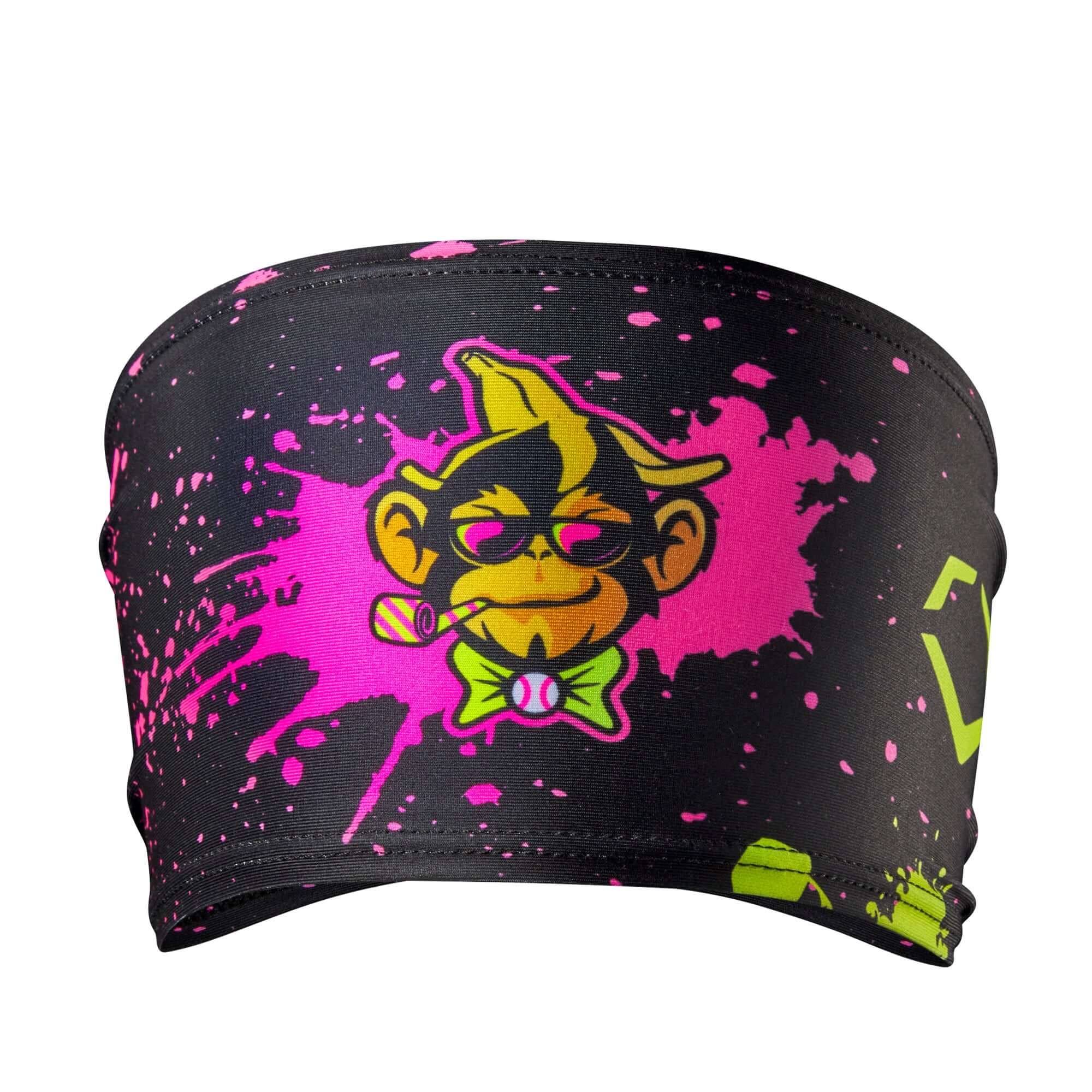 Evoshield Party Animals headband with paint splatter design featuring a cartoon monkey in vibrant colors.