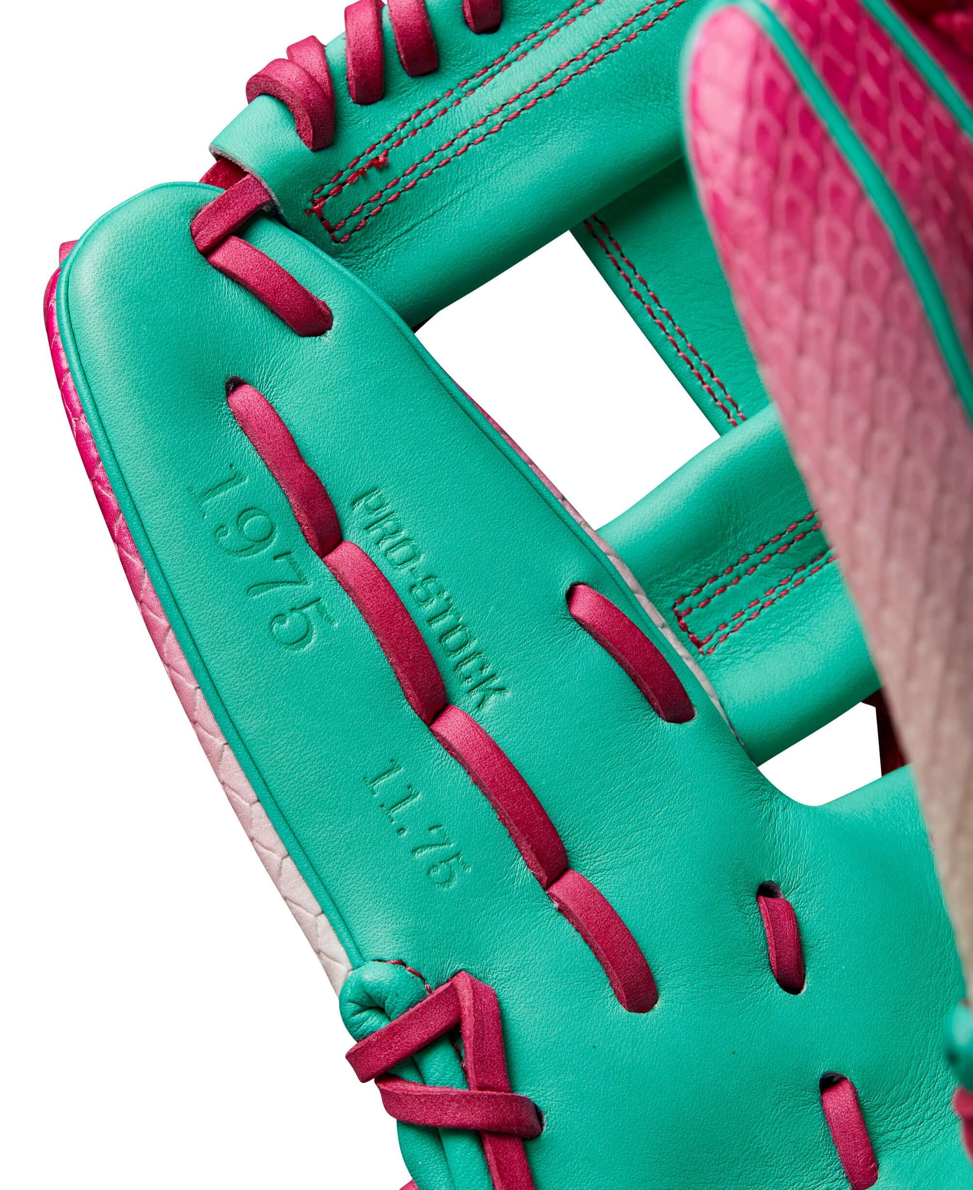 A2000 1975 glove interior showing pink and seafoam leather with Pro Stock® imprint and lacing details.