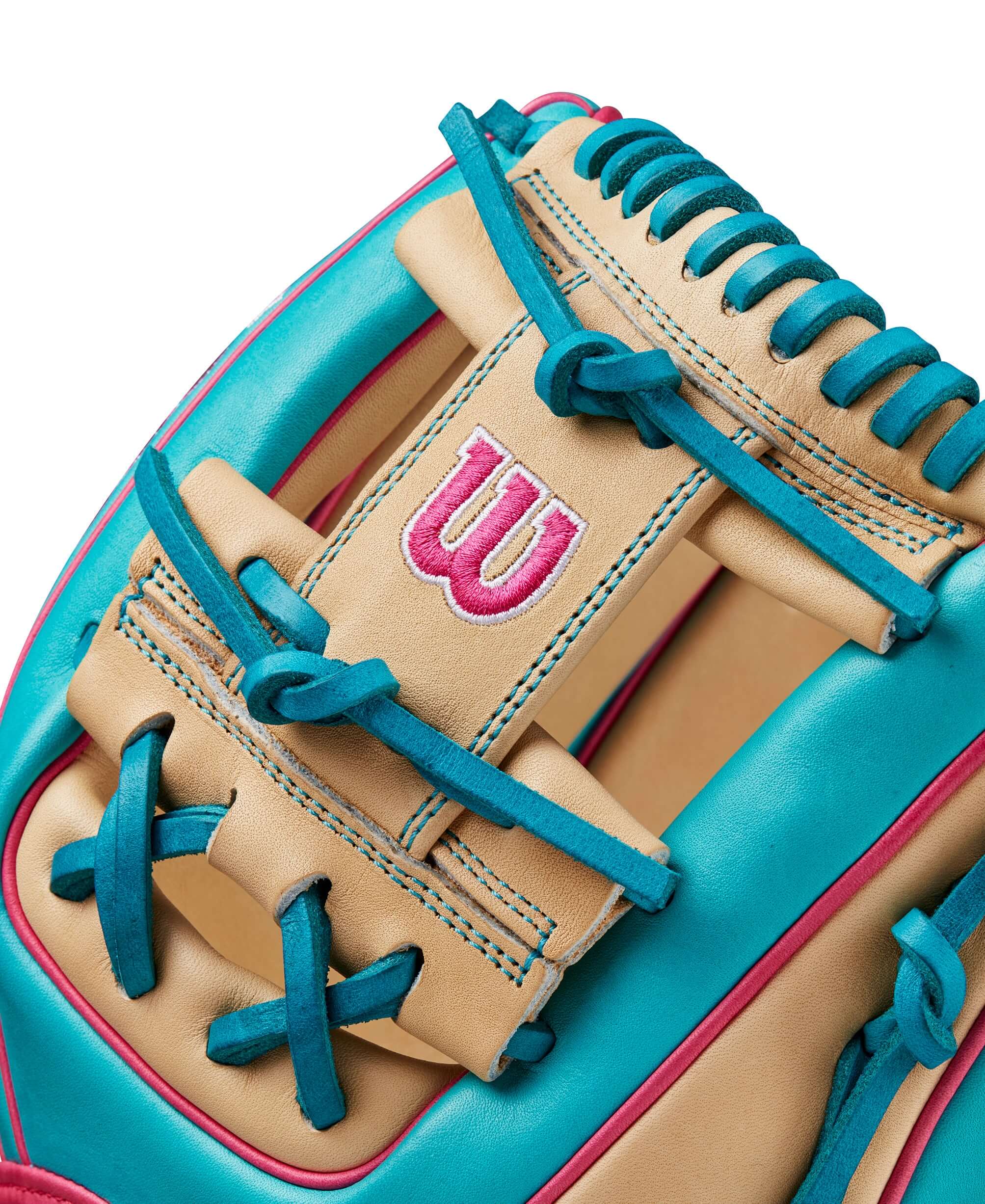 Wilson A2000 1786 glove in teal and blonde, showcasing vibrant laces and iconic logo detail.