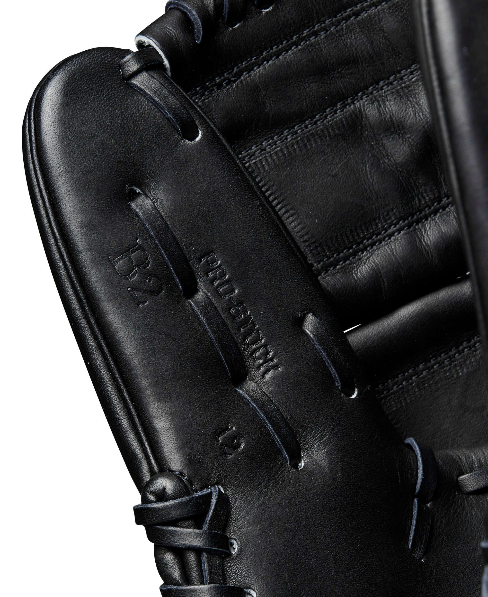 Close-up of Wilson 2024 A2000 B2 pitcher's glove interior, showcasing premium black Pro Stock leather and B2 stamp.