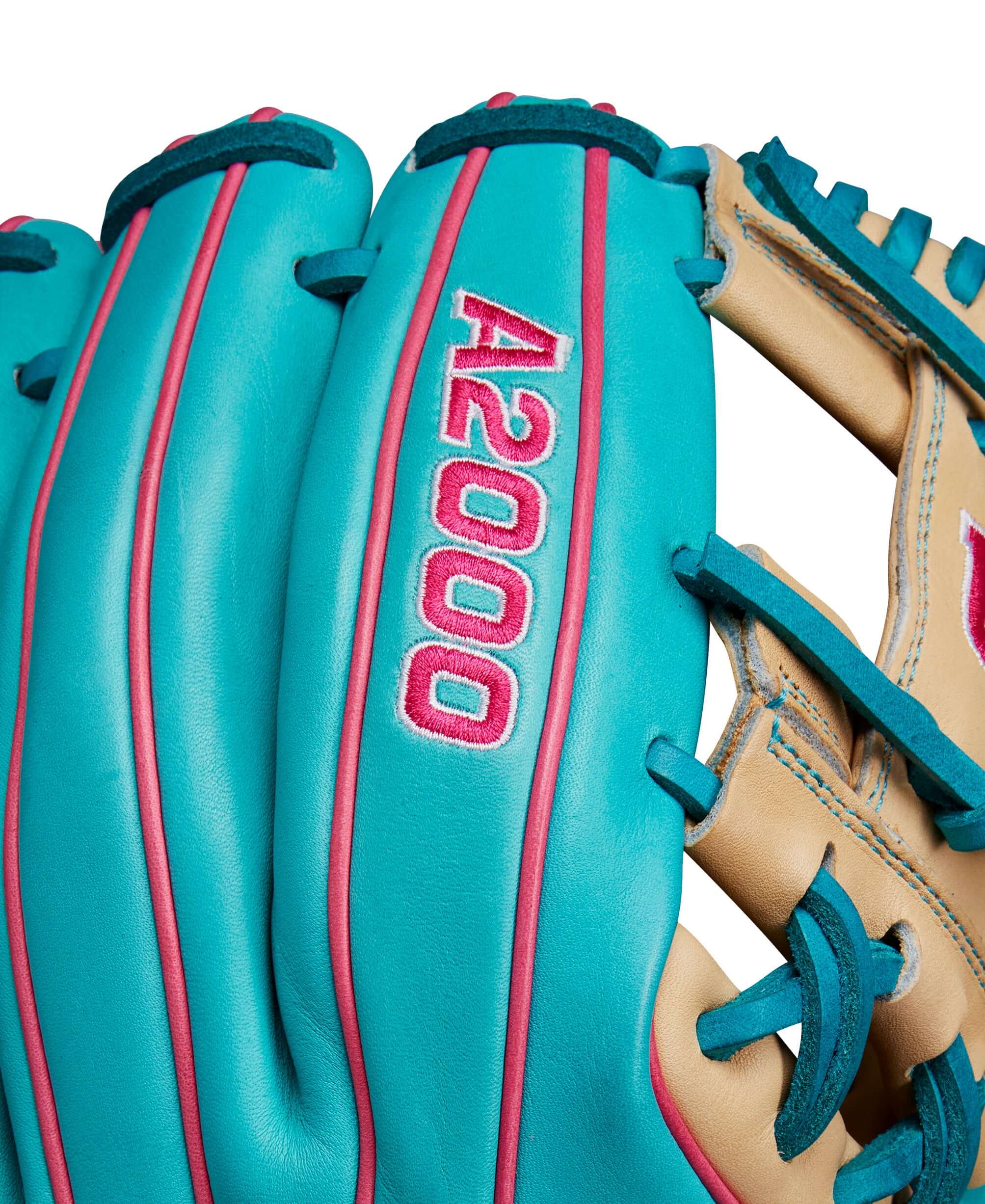 Wilson A2000 1786 teal and blonde baseball glove close-up, showcasing premium leather and vibrant design.