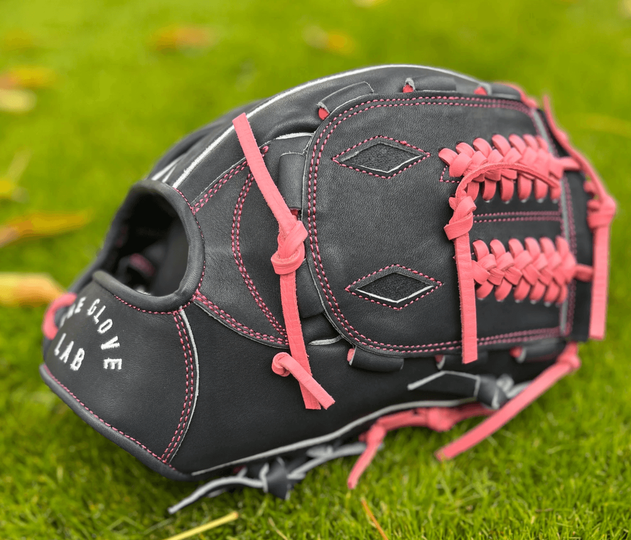 The Glove Lab 12" closed web pitcher's glove in navy/pink for ultimate ball concealment.